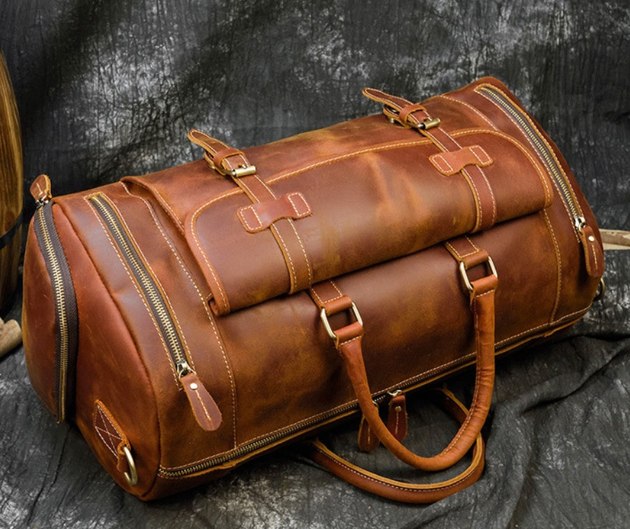 Red Brown leather travel bag, end pocket and zip detail