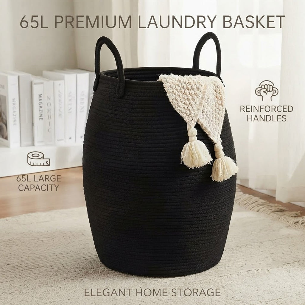 Black rope laundry basket with loop handles and a cream throw draped over the rim