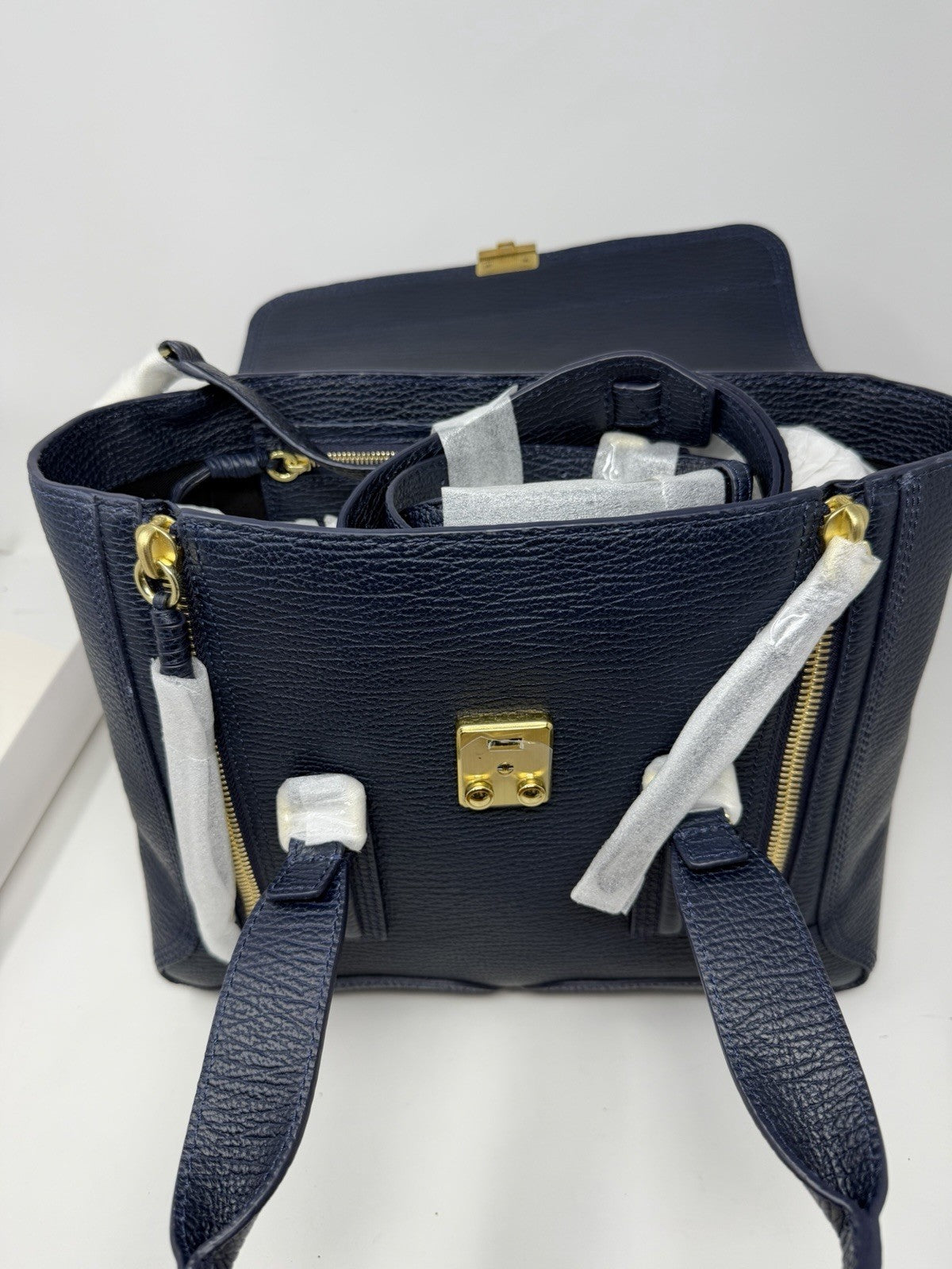 3.1 Phillip Lim Pashli medium satchel in navy pebbled leather, open top view of the interior