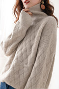 Camel relaxed turtleneck jumper, worn