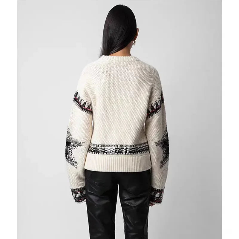 Cream star jumper, worn, back view