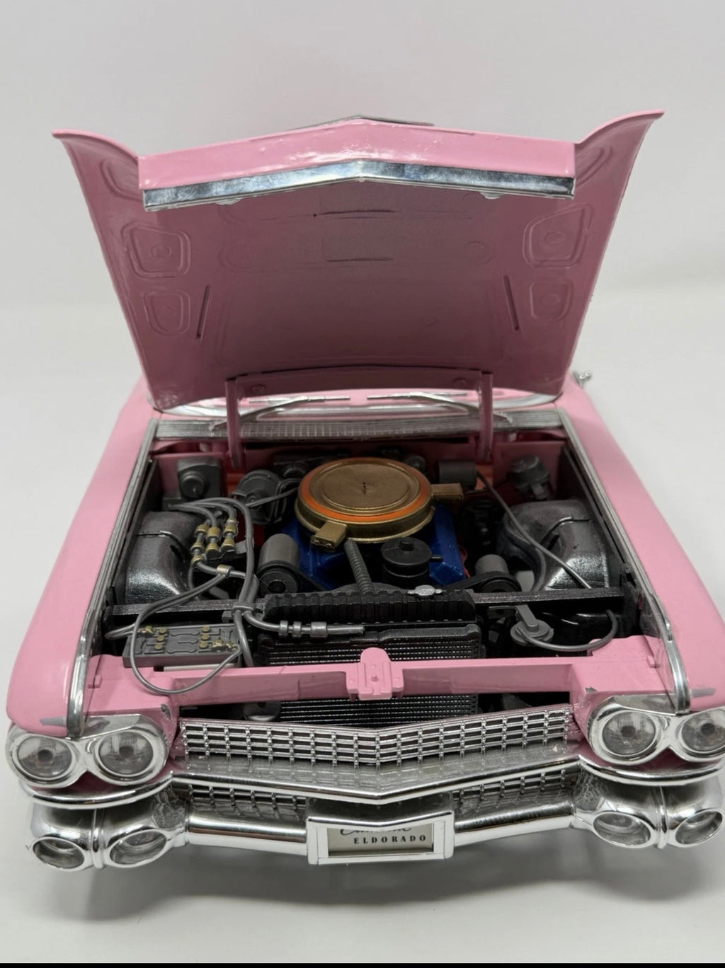 Pink Maisto 1959 Cadillac Eldorado Biarritz diecast convertible model, detailed collectible toy in 1:12 scale.