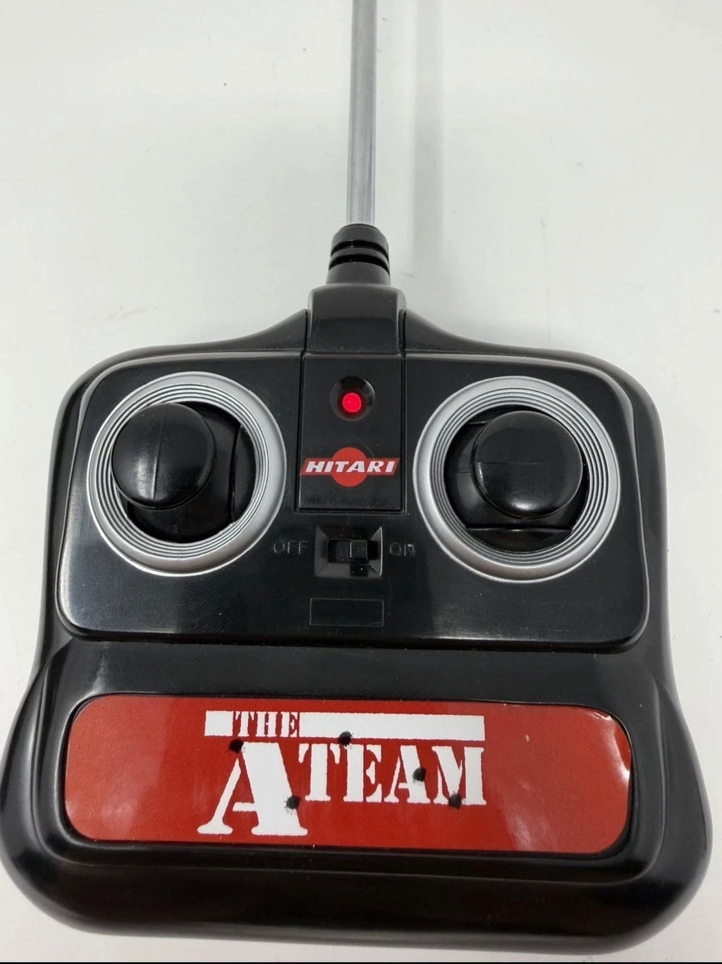 Vintage Hitari The A-Team GMC remote control van with original controller, detailed collectible toy in classic design.