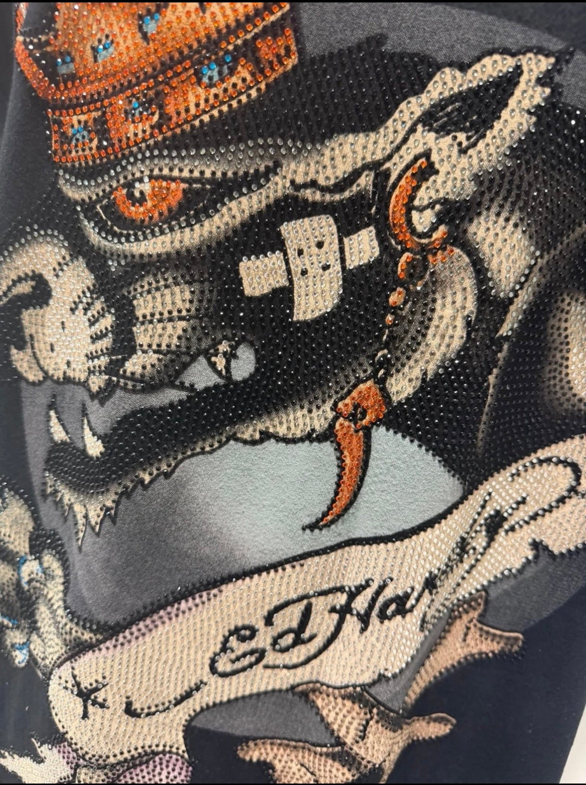 Black Ed Hardy T-shirt featuring a crowned panther rhinestone design, medium size, with vibrant graphic artwork.