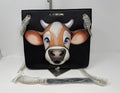Black Love Moschino shoulder bag with cow appliqué and chain strap, stylish accessory with bold design and branded details.