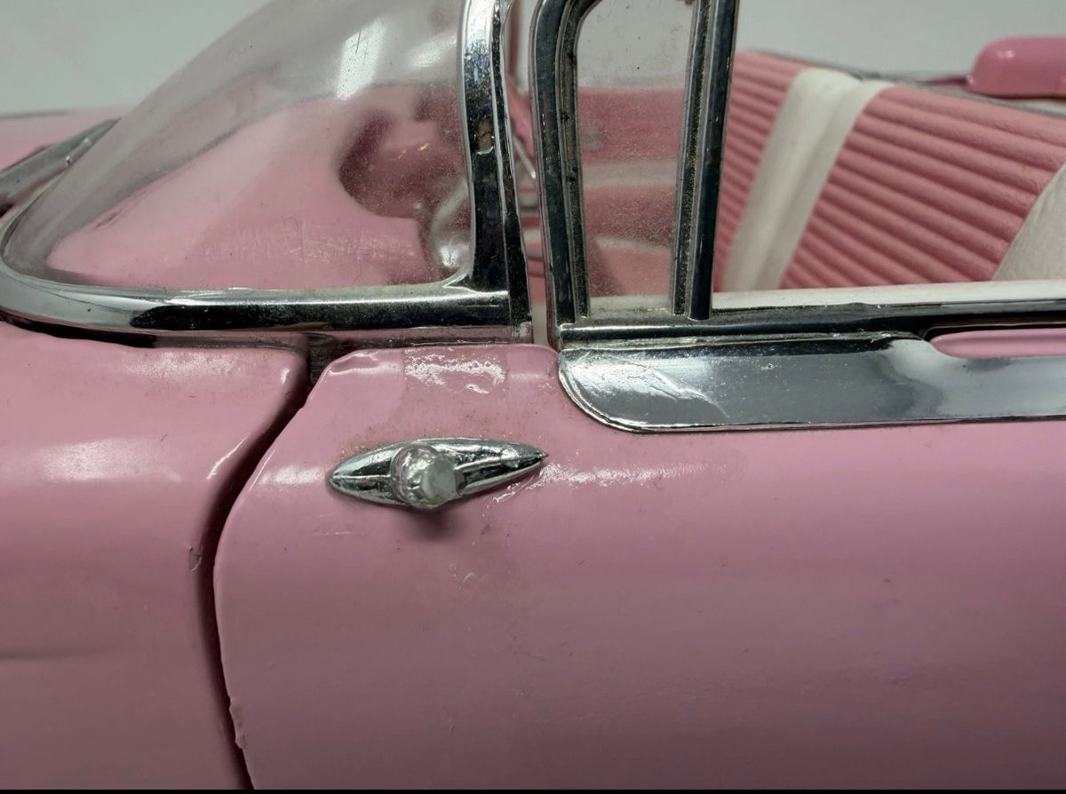 Pink Maisto 1959 Cadillac Eldorado Biarritz diecast convertible model, detailed collectible toy car, 1:12 scale.
