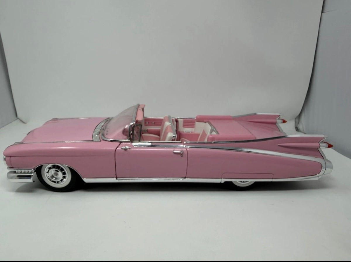 Pink Maisto 1959 Cadillac Eldorado Biarritz 1:12 diecast convertible model car, detailed collectible toy.