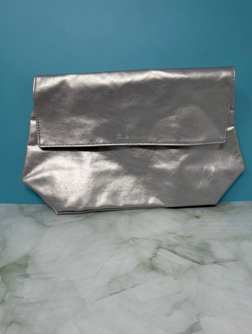 Elemis Pro-Collagen skincare gift set with assorted products inside a silver cosmetic bag, perfect for skincare enthusiasts.