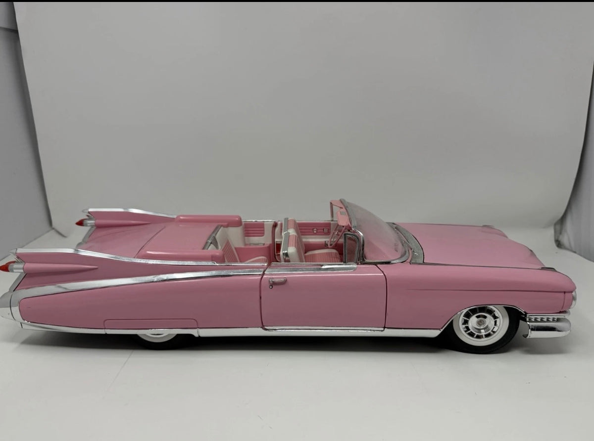 Pink Maisto 1:12 diecast Cadillac Eldorado Biarritz convertible toy car, detailed model in a collectible size.