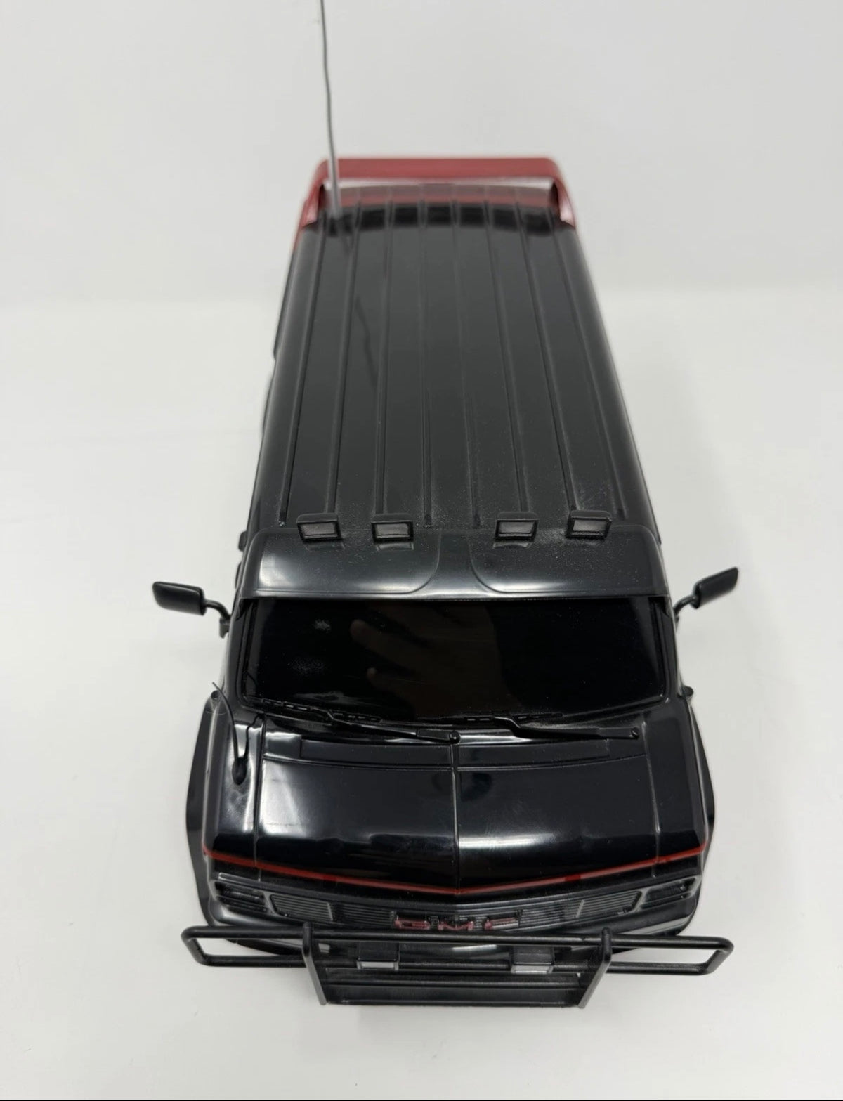 Vintage Hitari The A-Team GMC remote control van with original controller, detailed toy vehicle for collectors and play.