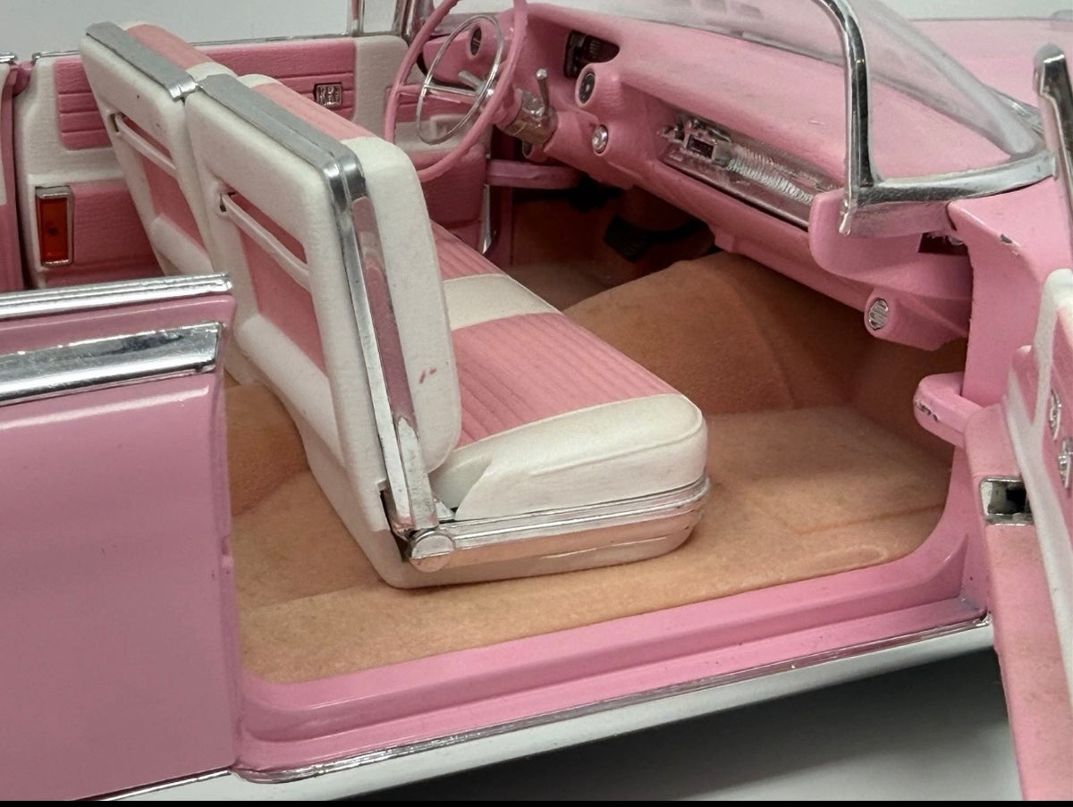 Pink Maisto 1:12 diecast Cadillac Eldorado Biarritz convertible, detailed toy model with open roof and realistic features.