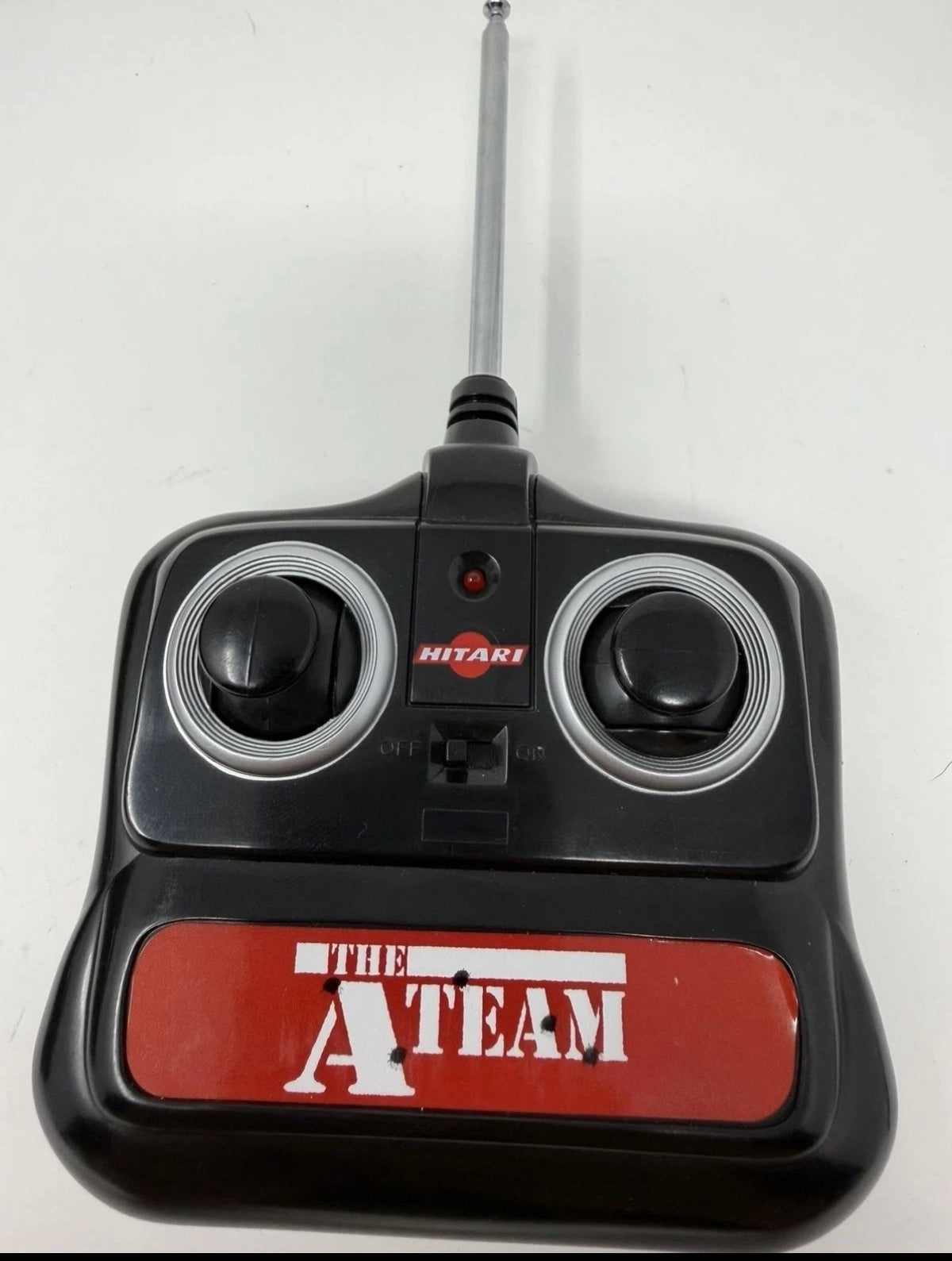 Vintage Hitari GMC radio-controlled van from The A-Team with original controller, detailed toy vehicle for remote control play.