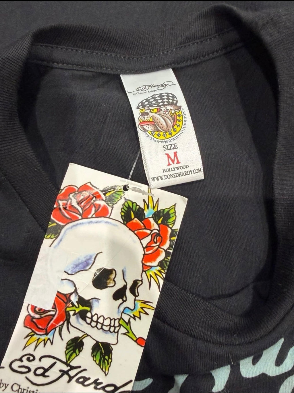 Black Ed Hardy T-shirt featuring a crowned panther rhinestone design, medium size, with graphic print on front.