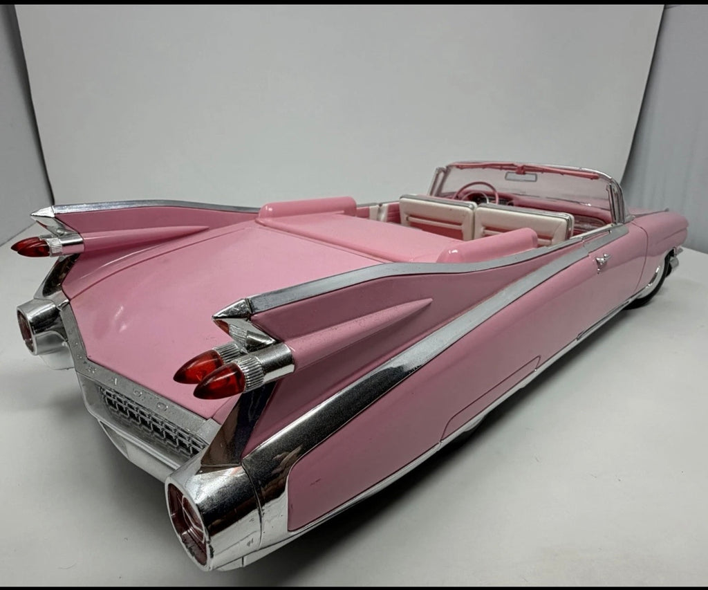 Pink Maisto 1959 Cadillac Eldorado Biarritz diecast convertible model, detailed collectible toy car with open top.