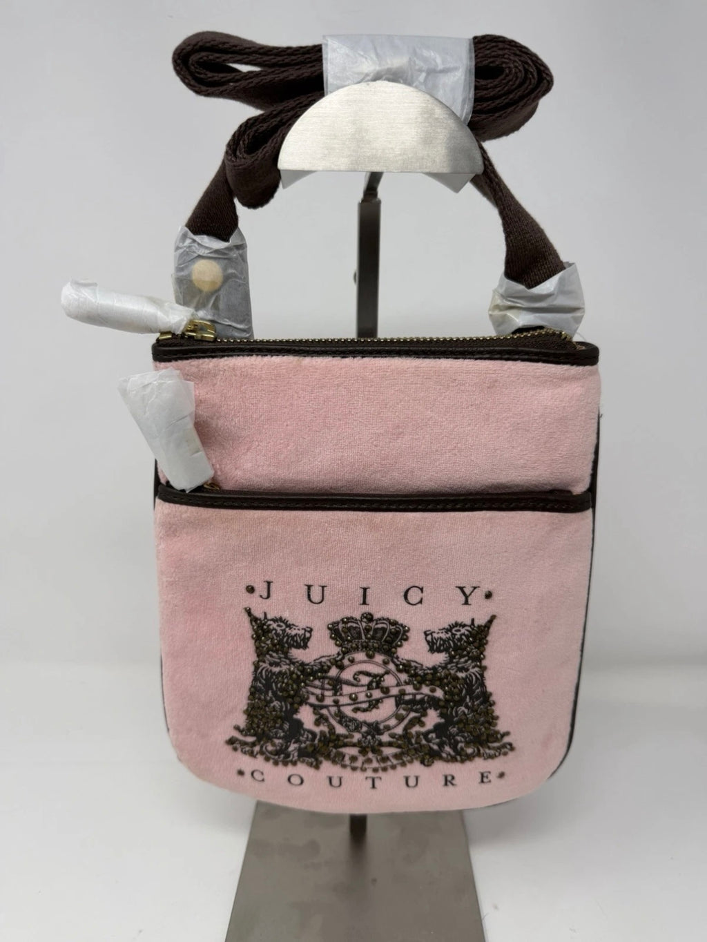 Juicy Couture pink velour crest crossbody bag with adjustable strap and gold-tone hardware, new with tags.