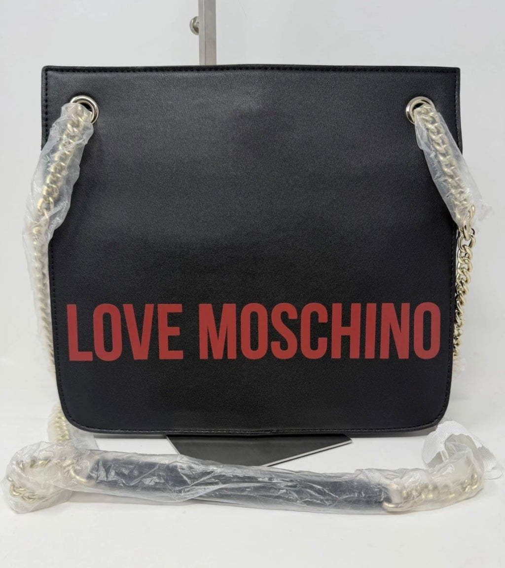 Black Love Moschino Cow Appliqué shoulder bag with chain strap, featuring playful cow design and stylish details.