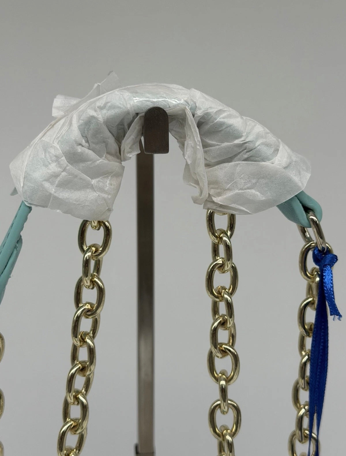 Versace Jeans mint green and black striped chain shoulder bag with gold-tone hardware and tag detail.