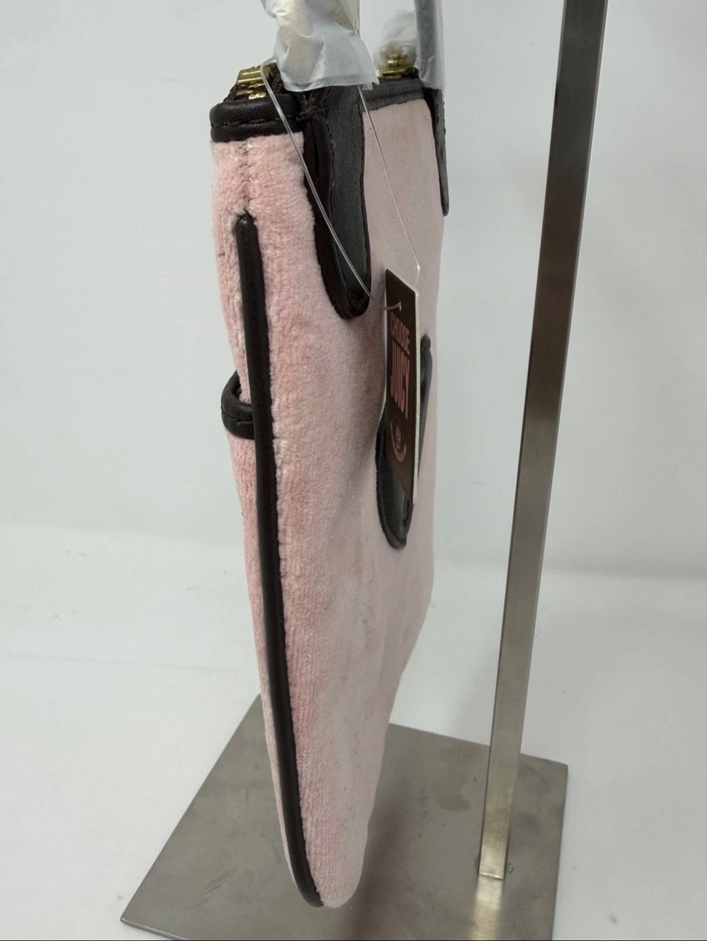 Juicy Couture pink velour crest crossbody bag with adjustable strap and gold-tone hardware, new with tags.