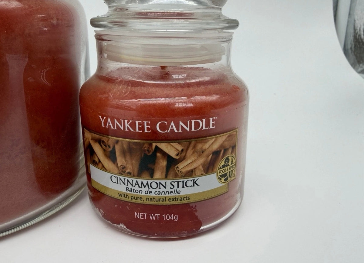 Yankee Candle Cinnamon Stick bundle with three jar candles and twelve tea lights, featuring warm cinnamon spice design.