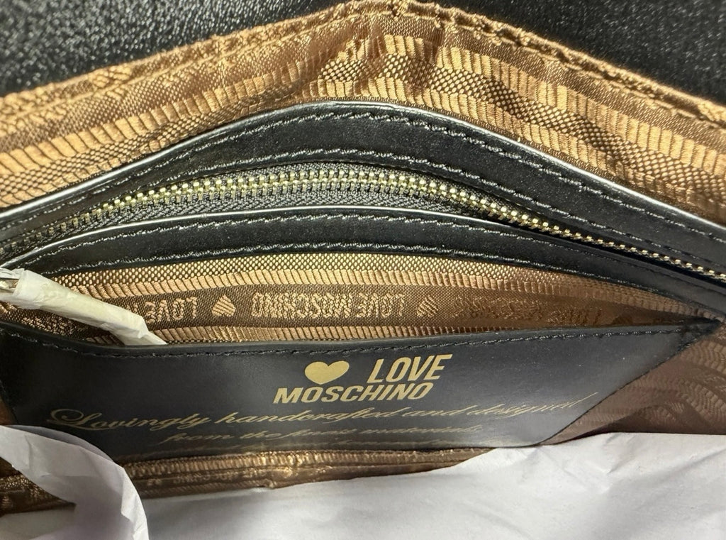 Love Moschino black shoulder bag with cow appliqué and chain strap, stylish accessory with bold design and textured details.