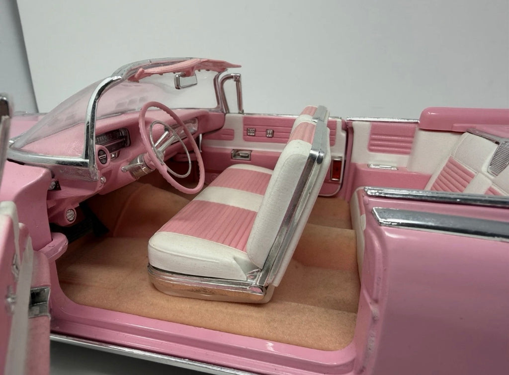 Pink Maisto 1:12 scale diecast Cadillac Eldorado Biarritz convertible toy model with detailed features.