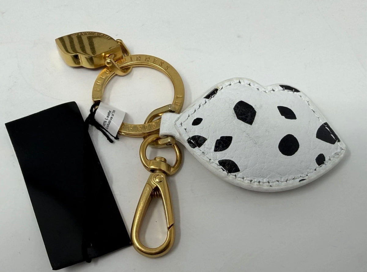 Lulu Guinness lips and leather keyring and bag charm featuring a bold red lip design and sleek black leather accents.
