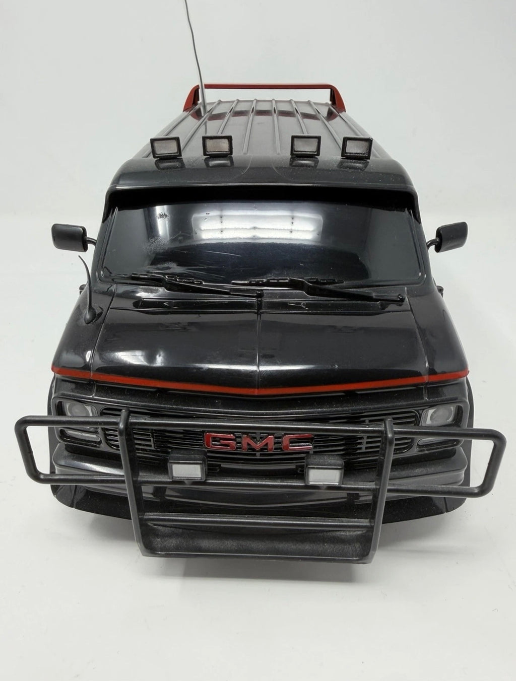 Vintage Hitari GMC radio-controlled van from The A-Team with original controller, detailed toy collectible in excellent condition.
