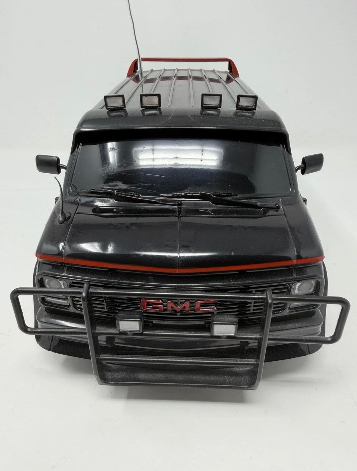 Vintage Hitari GMC radio-controlled van from The A-Team with original controller, detailed toy collectible in excellent condition.