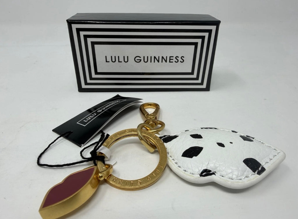 Lulu Guinness lips and leather keyring and bag charm with bold lips design and silver hardware on a neutral background.