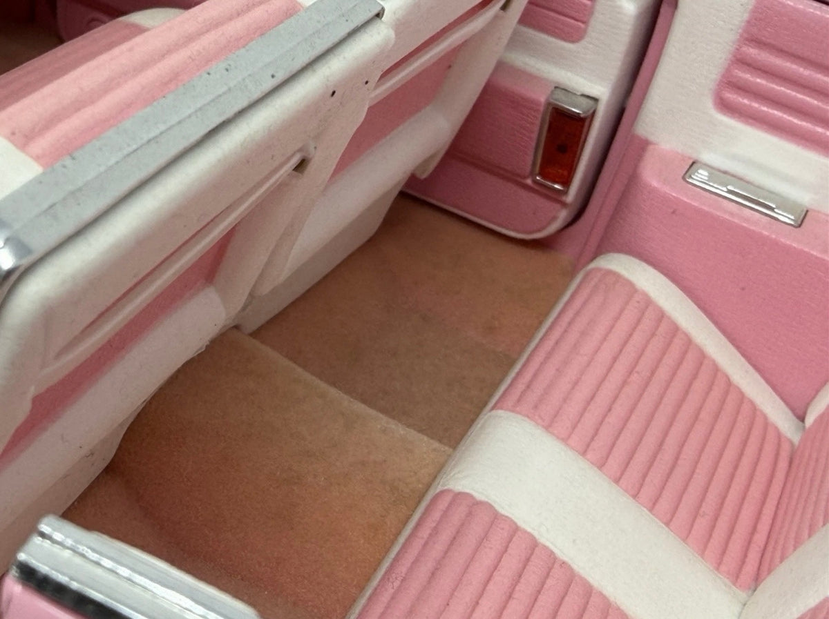 Pink Maisto 1:12 scale diecast model of a 1959 Cadillac Eldorado Biarritz convertible, detailed collectible toy car.