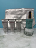 Elemis Pro-Collagen skincare gift set with multiple products and a silver cosmetic bag, displayed on a white background.