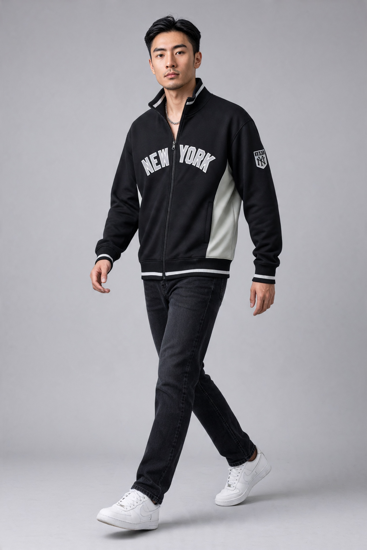 Black and white New York Yankees full-zip track jacket by Sport AX, shown in large size with team logo and sporty style.