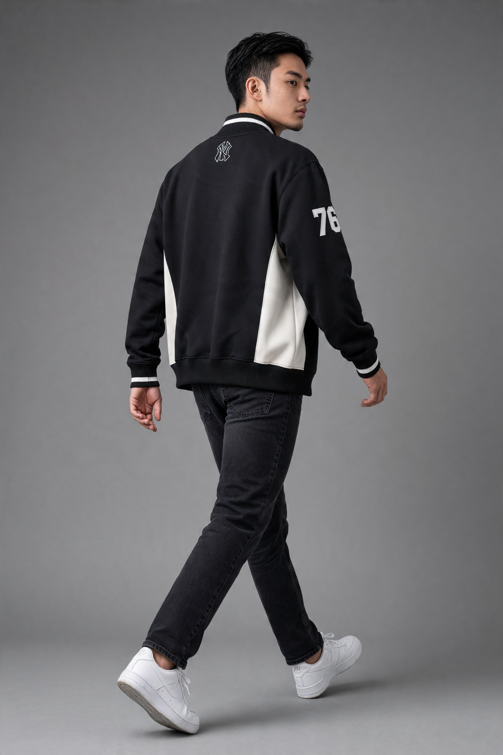 Black and white New York Yankees full-zip track jacket by Sport AX, shown on a hanger, size large, with team logo visible.