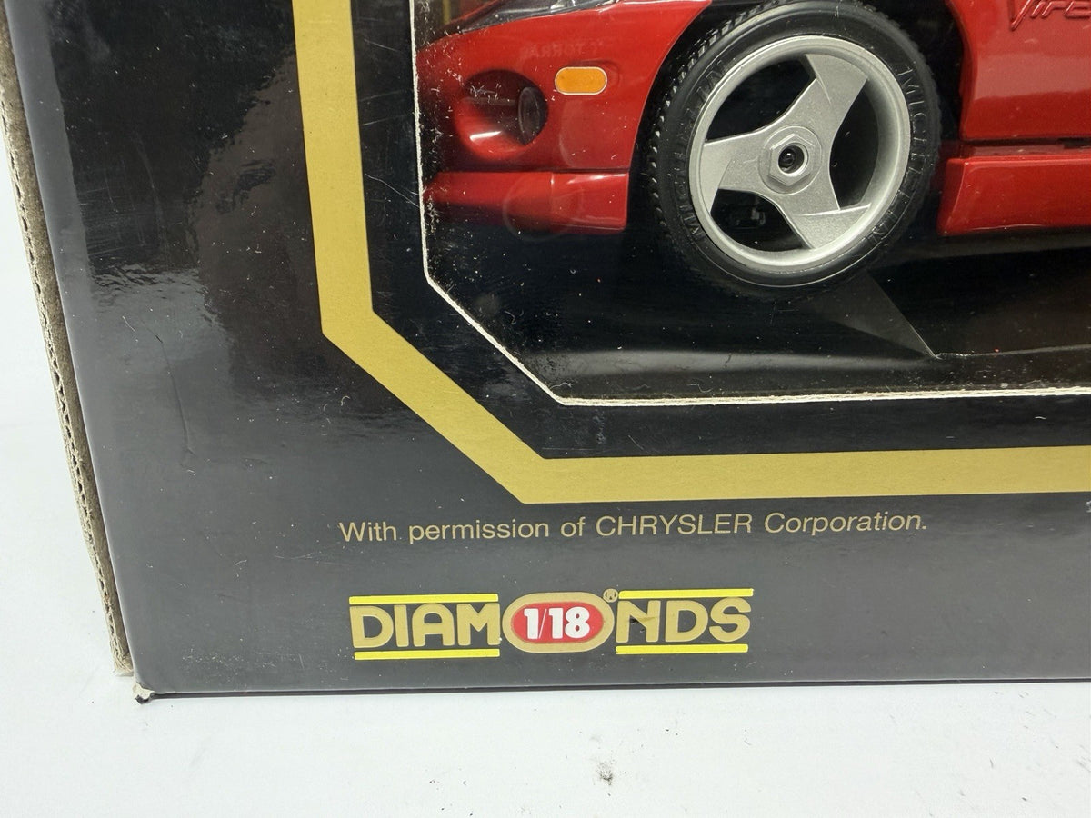 Bburago Diamonds 1:18 red Dodge Viper RT/10 1992 box front with Diamonds 1:18 logo and Chrysler permission line