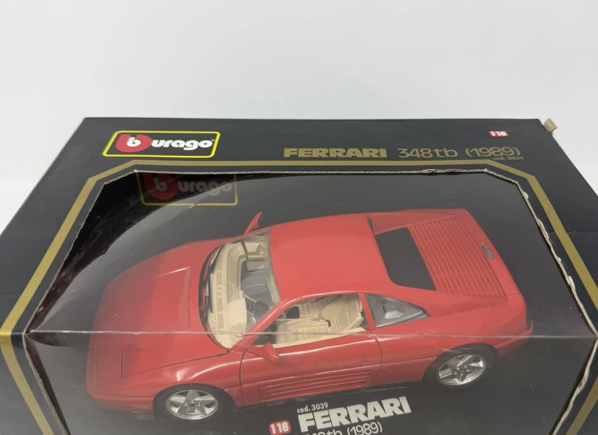 Red Bburago Ferrari 348tb 1:18 diecast model car in box, detailed collectible toy.