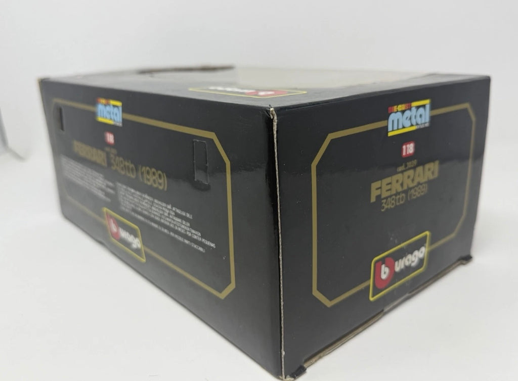 Red Bburago Ferrari 348tb 1989 diecast model car in box, detailed 1:18 scale collectible toy with No. 3039 branding.