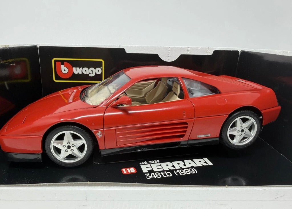 Red Bburago Ferrari 348tb 1989 diecast model car in box, detailed 1:18 scale collectible.