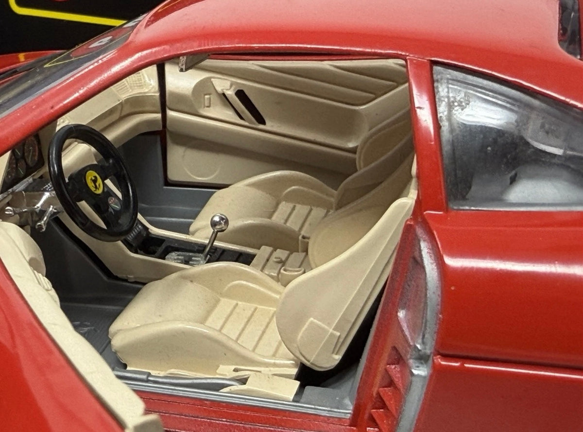 Red Bburago Ferrari 348tb 1:18 diecast model car, boxed, detailed scale model of 1989 Ferrari 348tb in a collectible display.