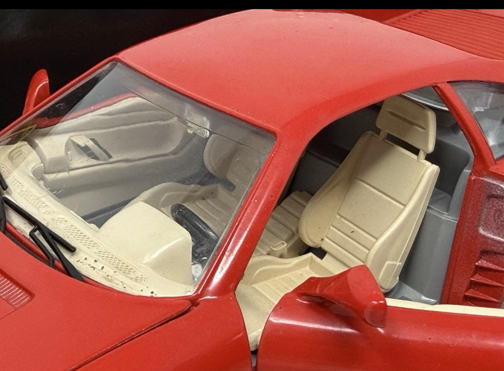 Red Bburago Ferrari 348tb 1989 diecast model car in box, 1:18 scale, collectible toy with detailed features.