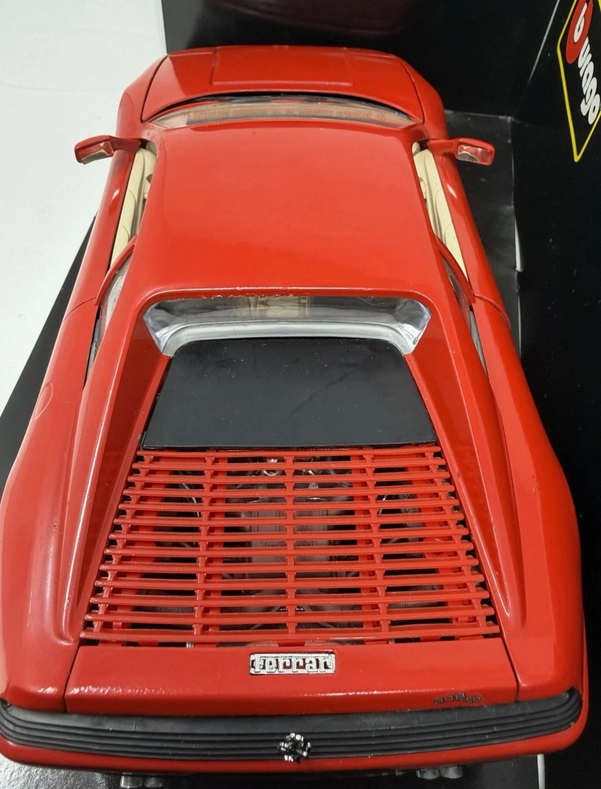 Red Bburago Ferrari 348tb 1989 diecast model car in box, detailed 1:18 scale collectible toy with No. 3039 label.