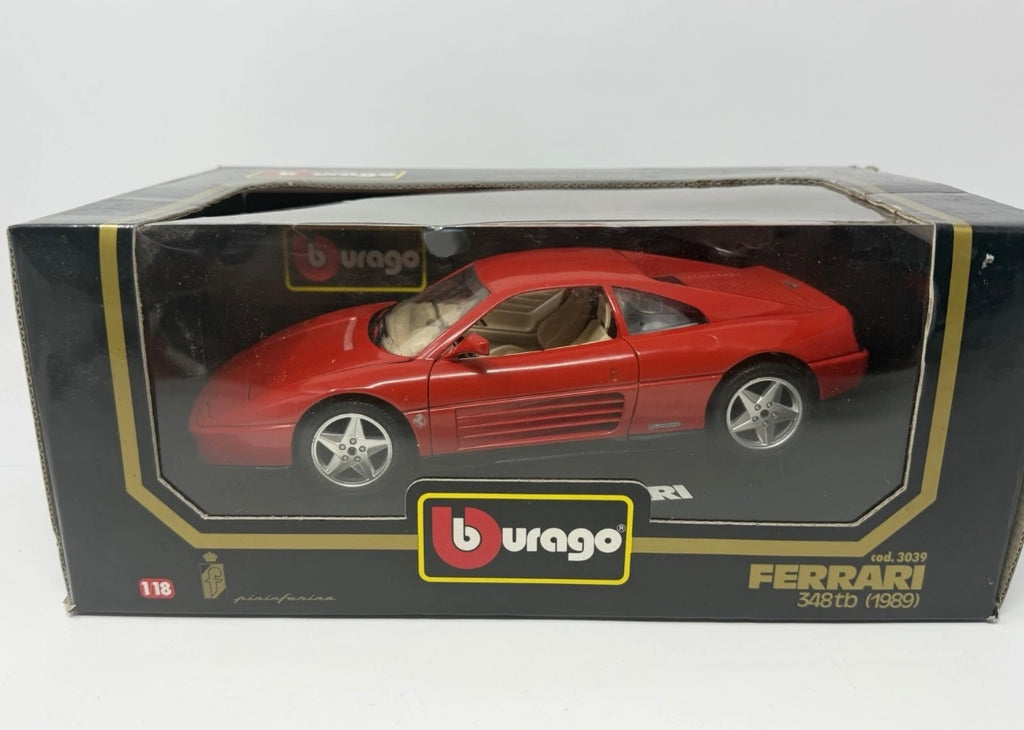 Red Bburago Ferrari 348tb 1:18 diecast model car in box, showcasing detailed collectible toy with No. 3039 label.