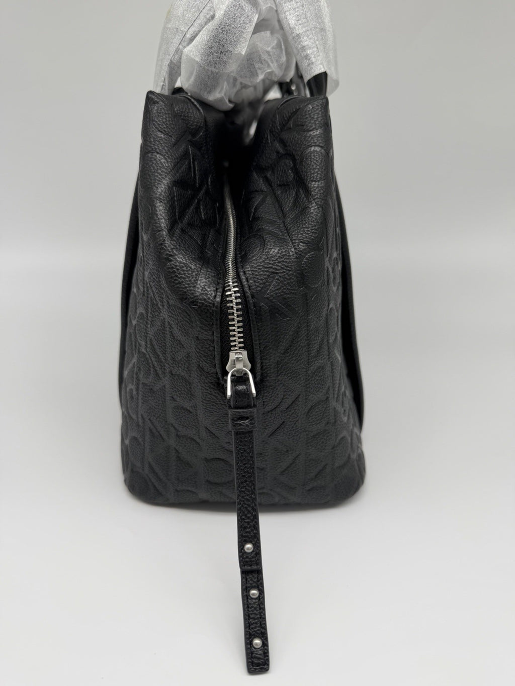 Black Calvin Klein Misha Duffle Bag with CK monogram, strap, and dust bag, new with tags, stylish travel holdall