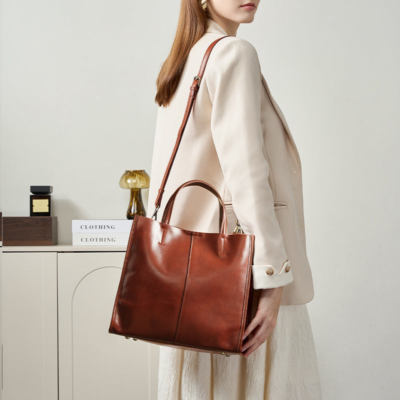 Soft cowhide leather handbag in Wine Brown worn on the shoulder