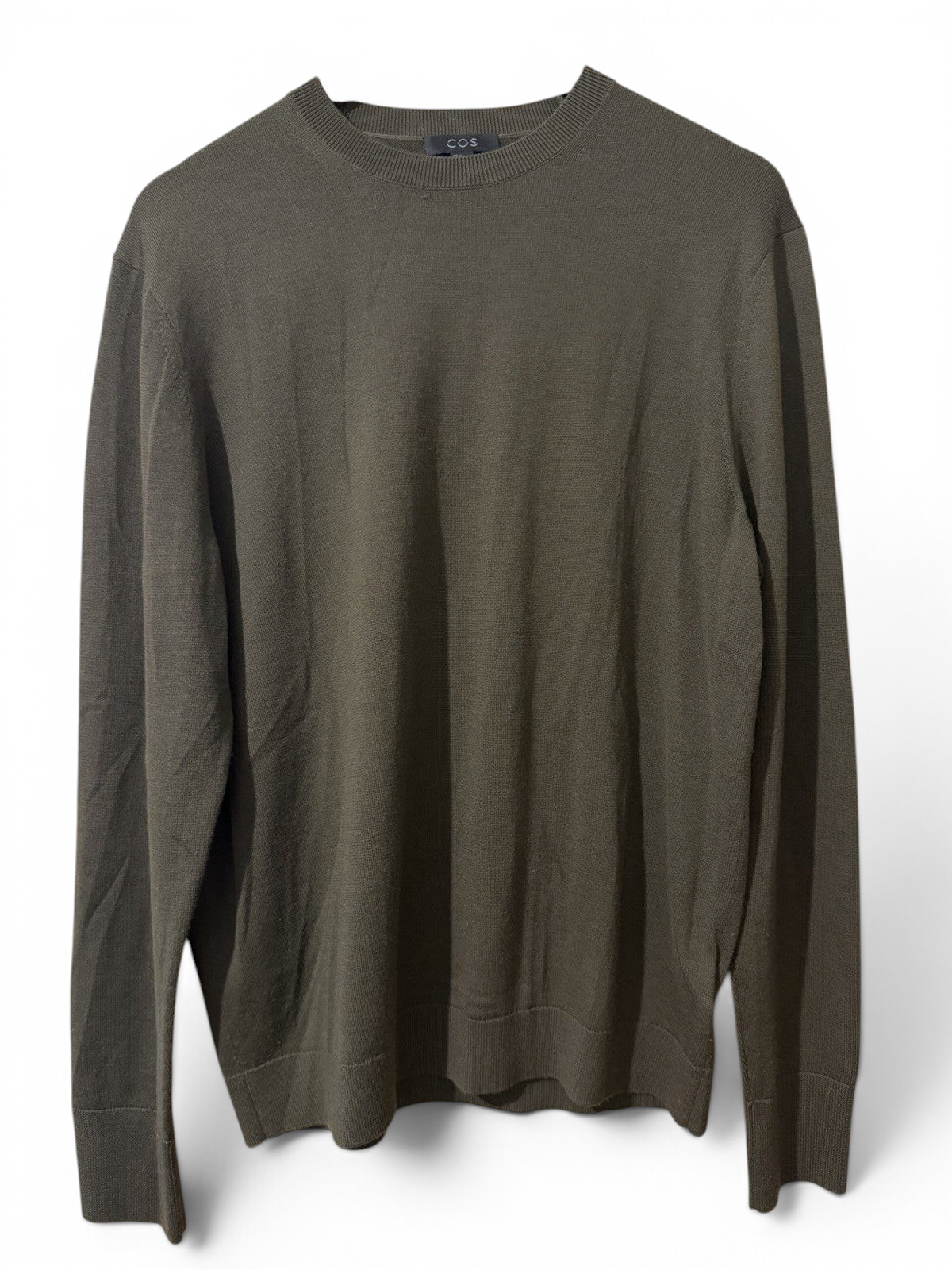 Men's COS olive green wool crew neck jumper in size M, pre-owned, shown flat with ribbed cuffs and neckline.