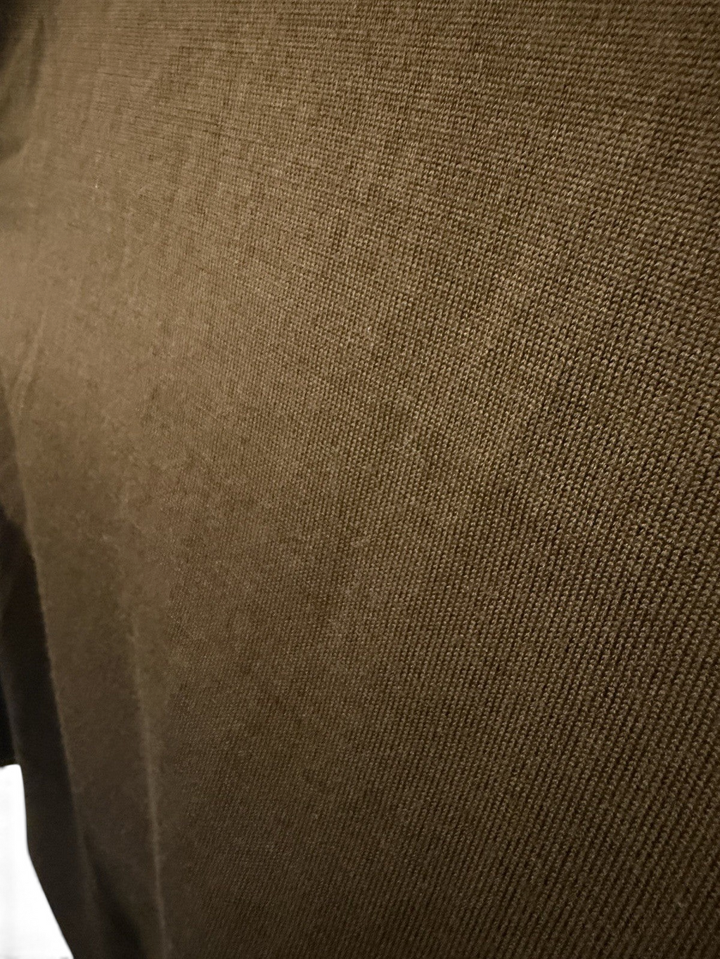 Men's COS olive green wool crew neck jumper, size M, pre-owned, with a close-up of the soft knit fabric and classic fit.