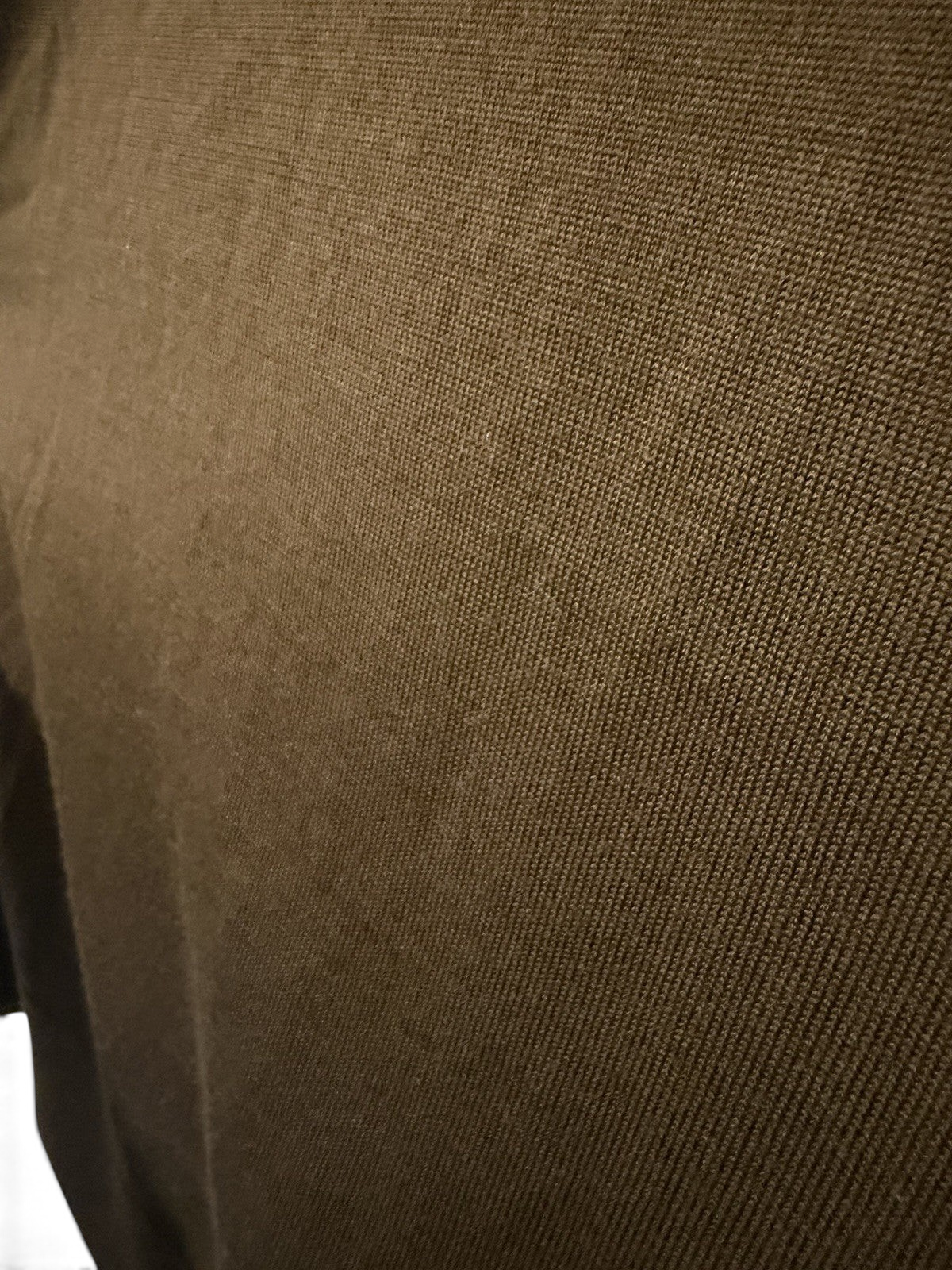 Men's COS olive green wool crew neck jumper, size M, pre-owned, with a close-up of the soft knit fabric and classic fit.