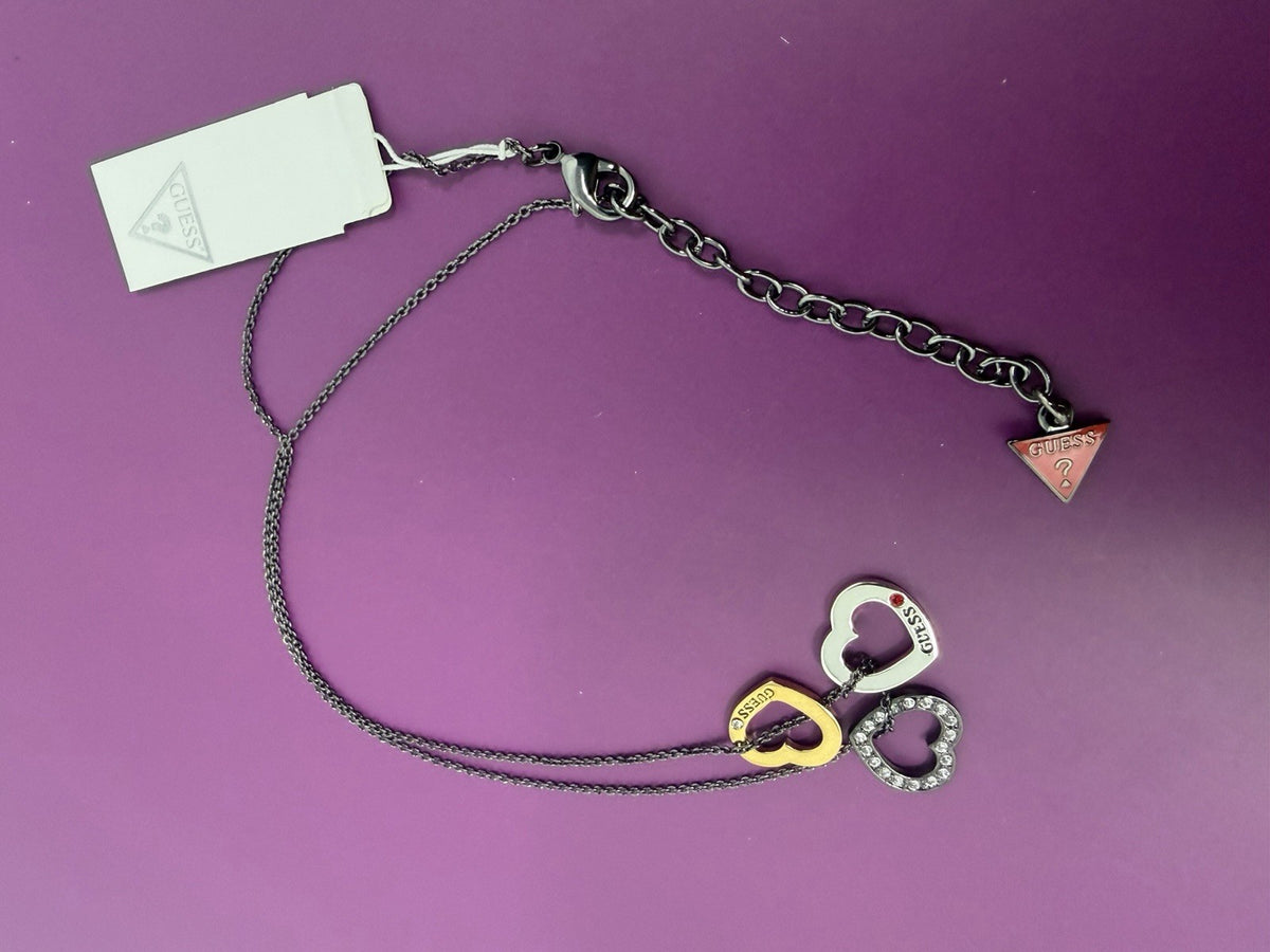 Guess Multi Heart Charm Pendant Necklace from Series VII Spring 2011, featuring multiple heart charms on a delicate chain.