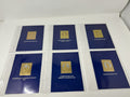 New Elizabethan Golden Age 23ct gold stamp collection, six mounted gold stamps on blue pages