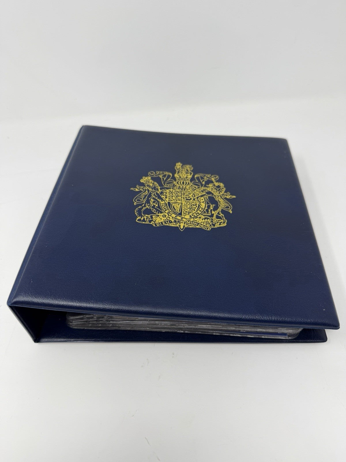 New Elizabethan Golden Age 23ct gold stamp collection, closed presentation binder with royal crest