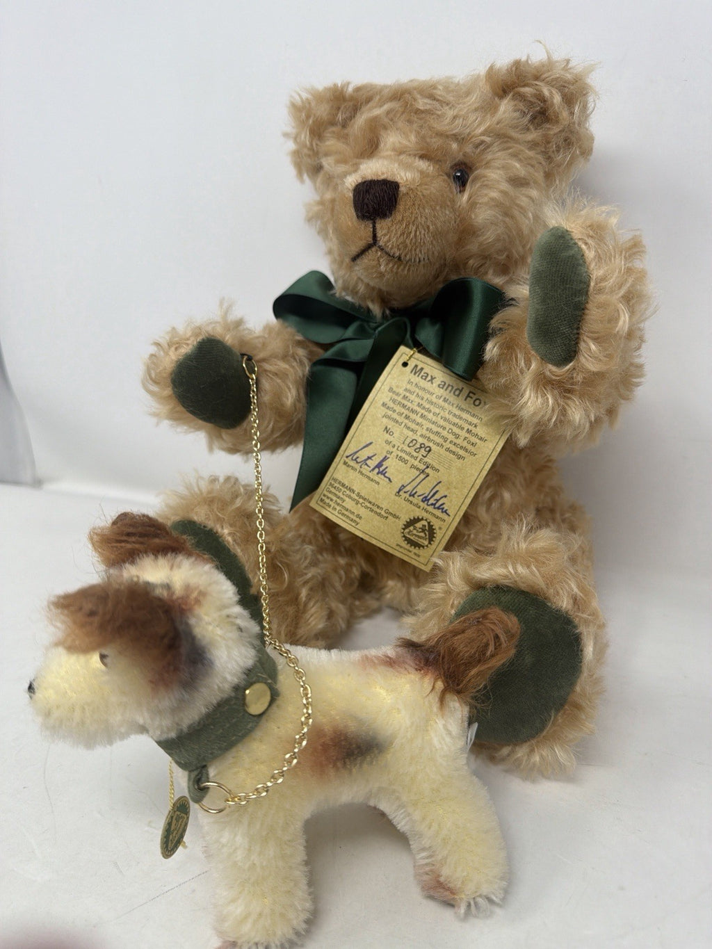 Hermann Coburg Max and Foxl mohair bear and dog, angled front view with green satin bow and swing tag